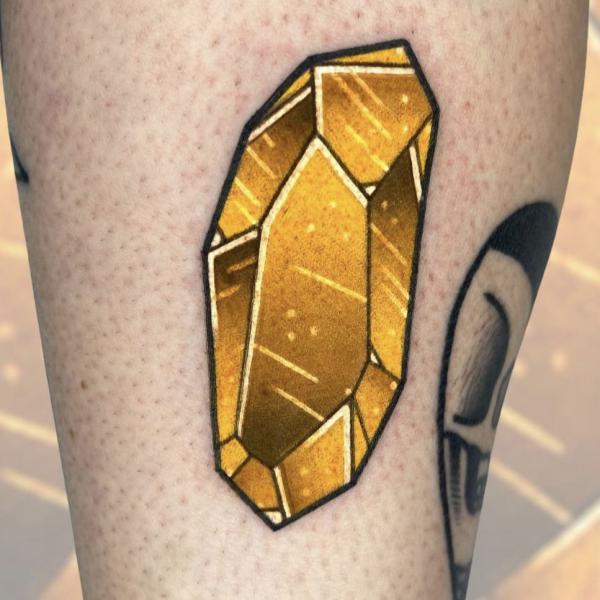 Yellow crystal tattoo