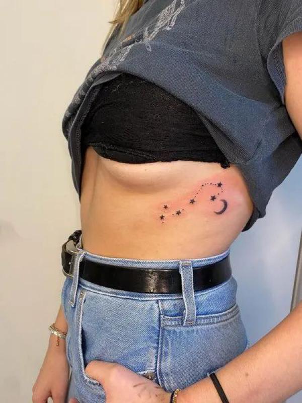 Zodiac constellation side boob tattoo