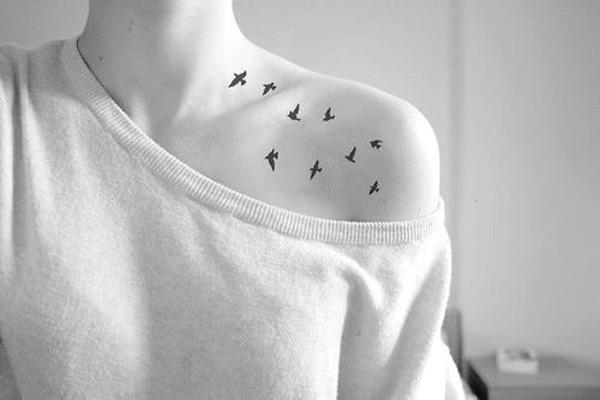 birds clavicle tattoo