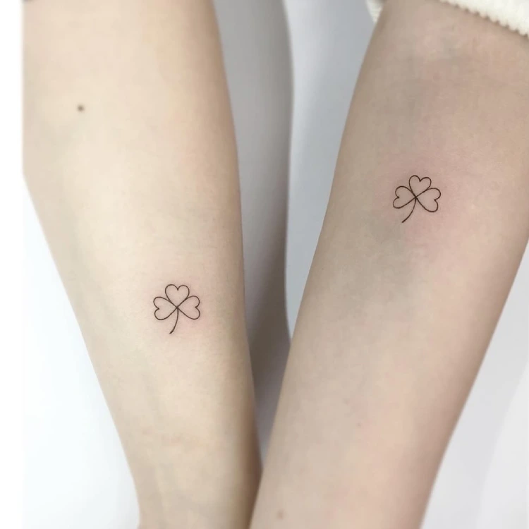 Matching Clover tattoo on the inner arm