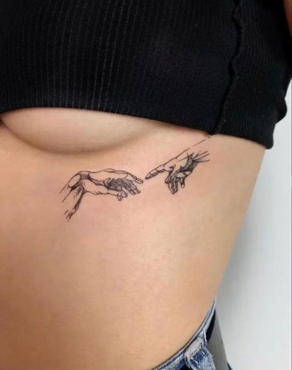 creation of adam side boob tattoo