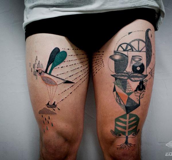 abstract surreal style tattoo on thighs