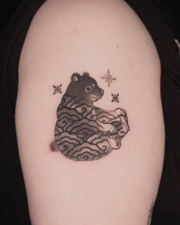 Shining patterned bear tattoo by @e.o.orient