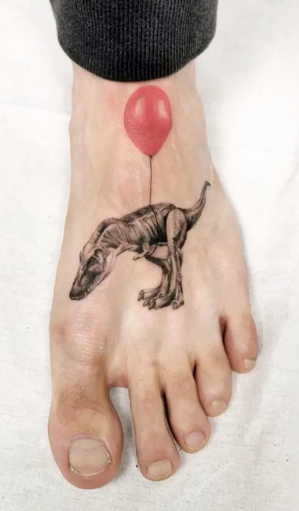 T-rex and ballon foot tattoo by @ikarus.abendwind