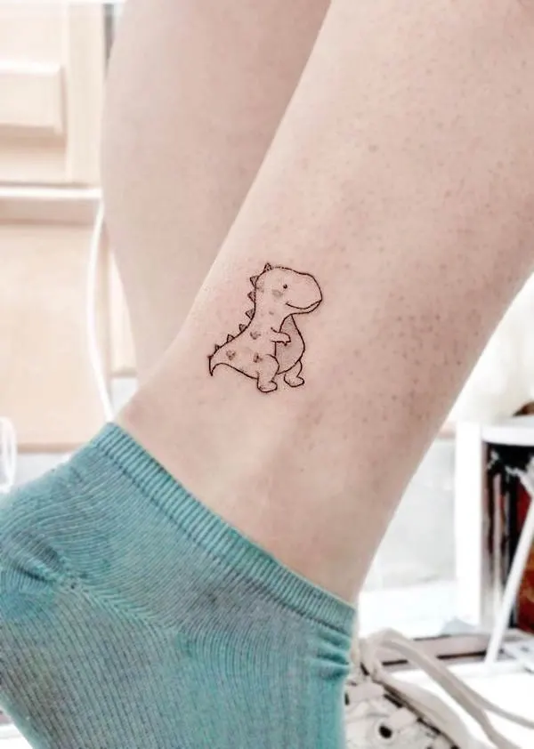 Small cartoon dinosaur above the ankle tattoo by @jskacampos