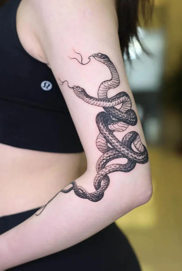 Snake tattoo around the elbow by @strokin_dark