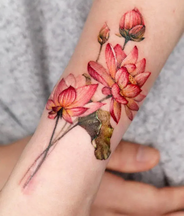 Blooming lotus forearm tattoo by @chou_ta_1