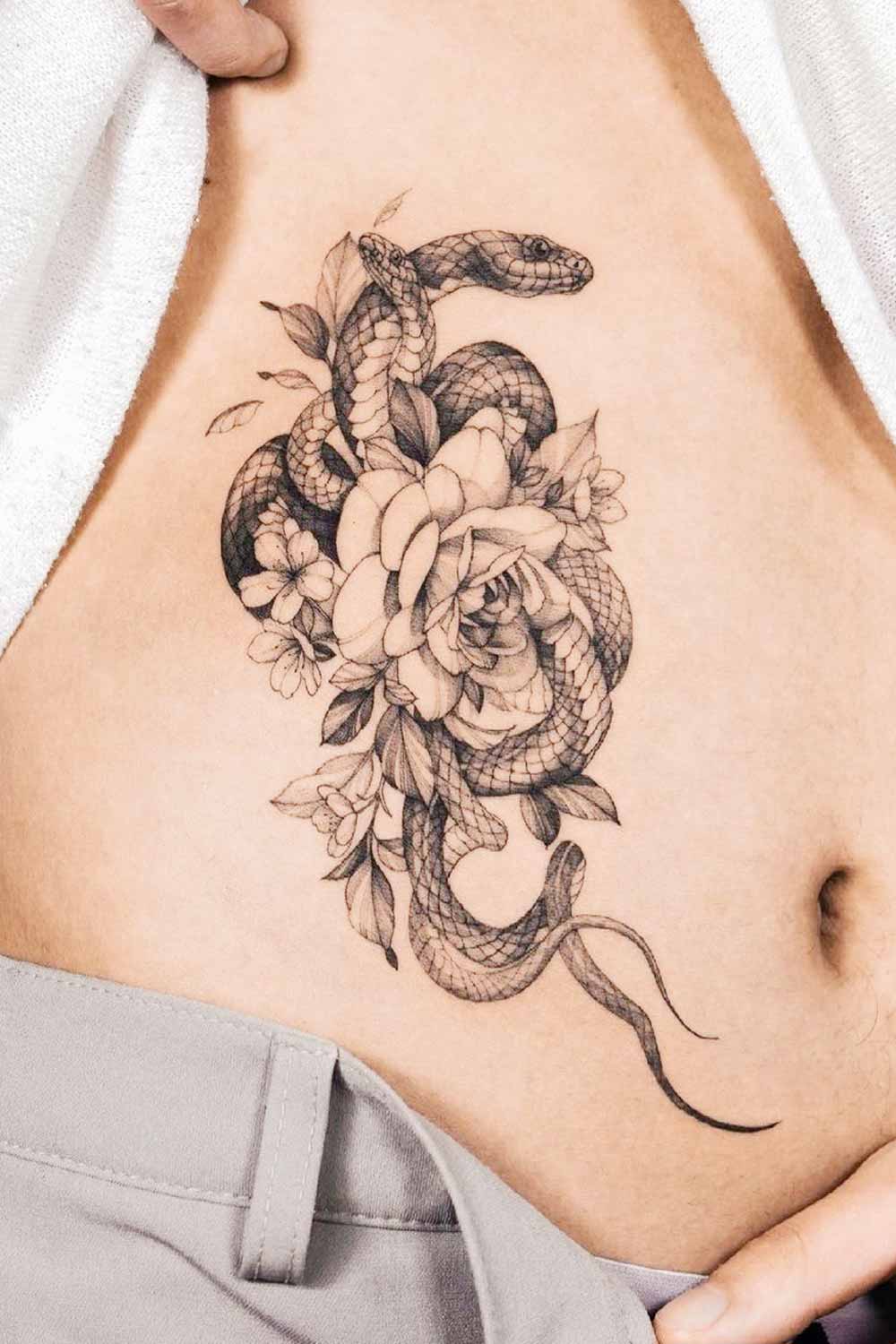 Snake with Flowers Tattoo Design