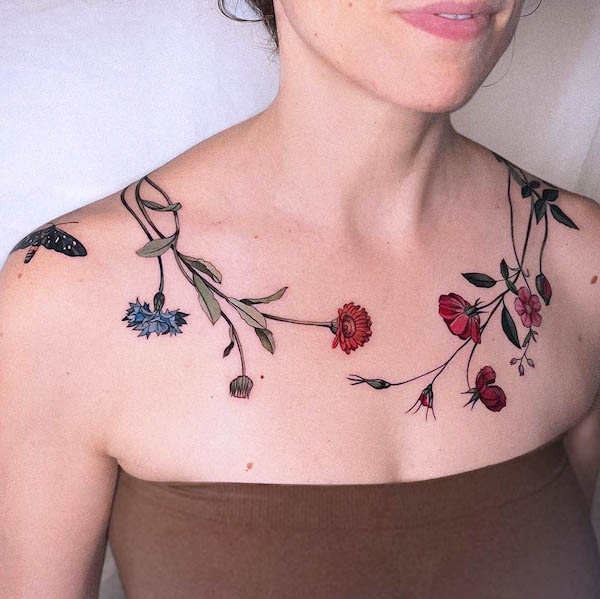 Flowers and branches chest tattoo by @vanessa.core