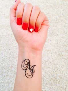 Initials tattoo with script AJ